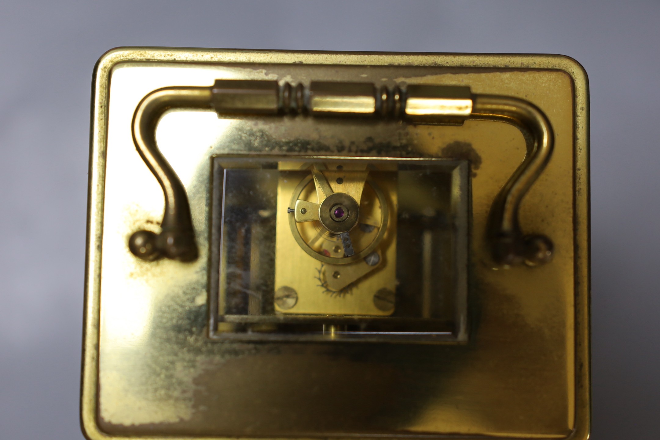 A five draw telescope, a pair of cased binoculars, postal scales and a brass timepiece, telescope drawn 69 cms long